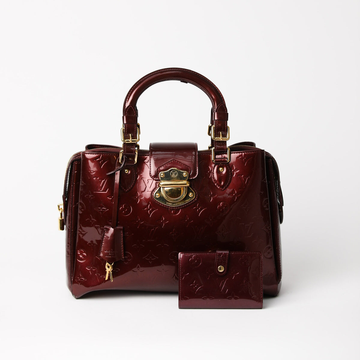 LOUIS VUITTON  Plum Patent Leather Top Handle with Matching Wallet – The  Vault By Volpe Beringer